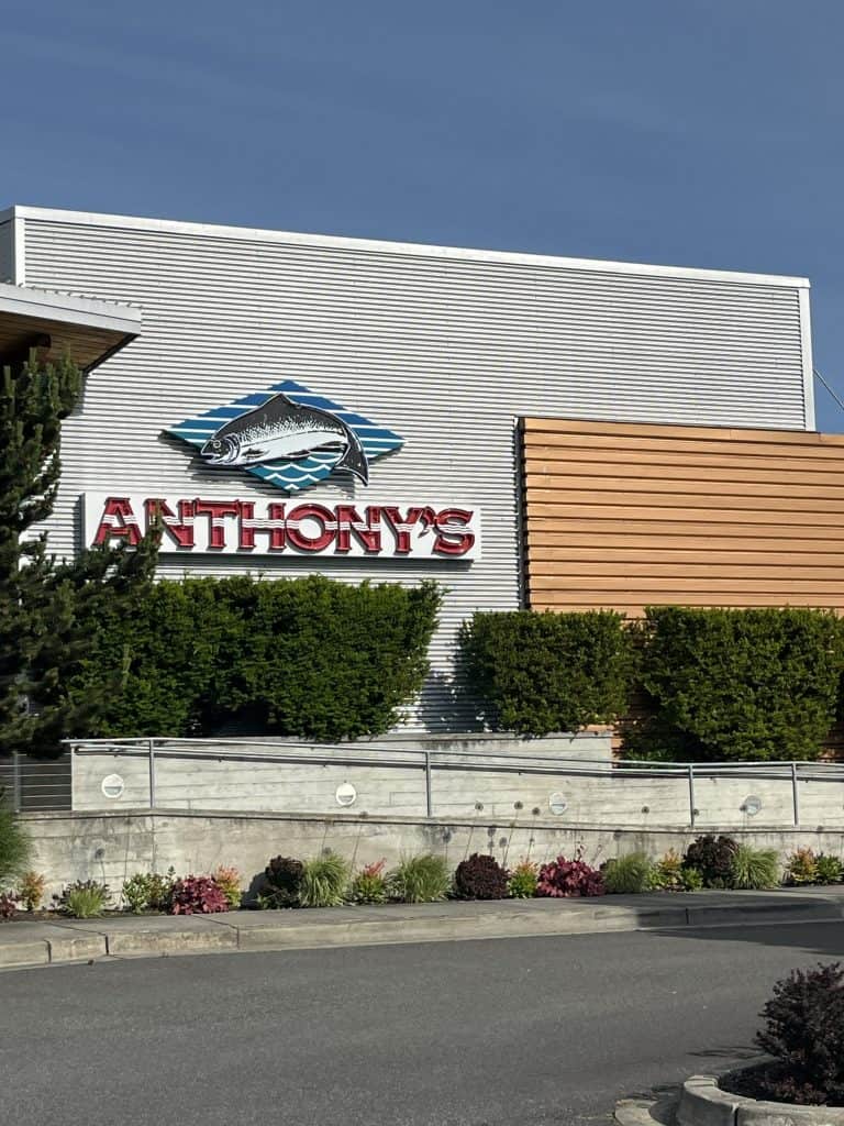 Exterior of Anthony’s at Cap Sante Marina restaurant in Anacortes, Washington, featuring the signature fish logo and modern waterfront design.