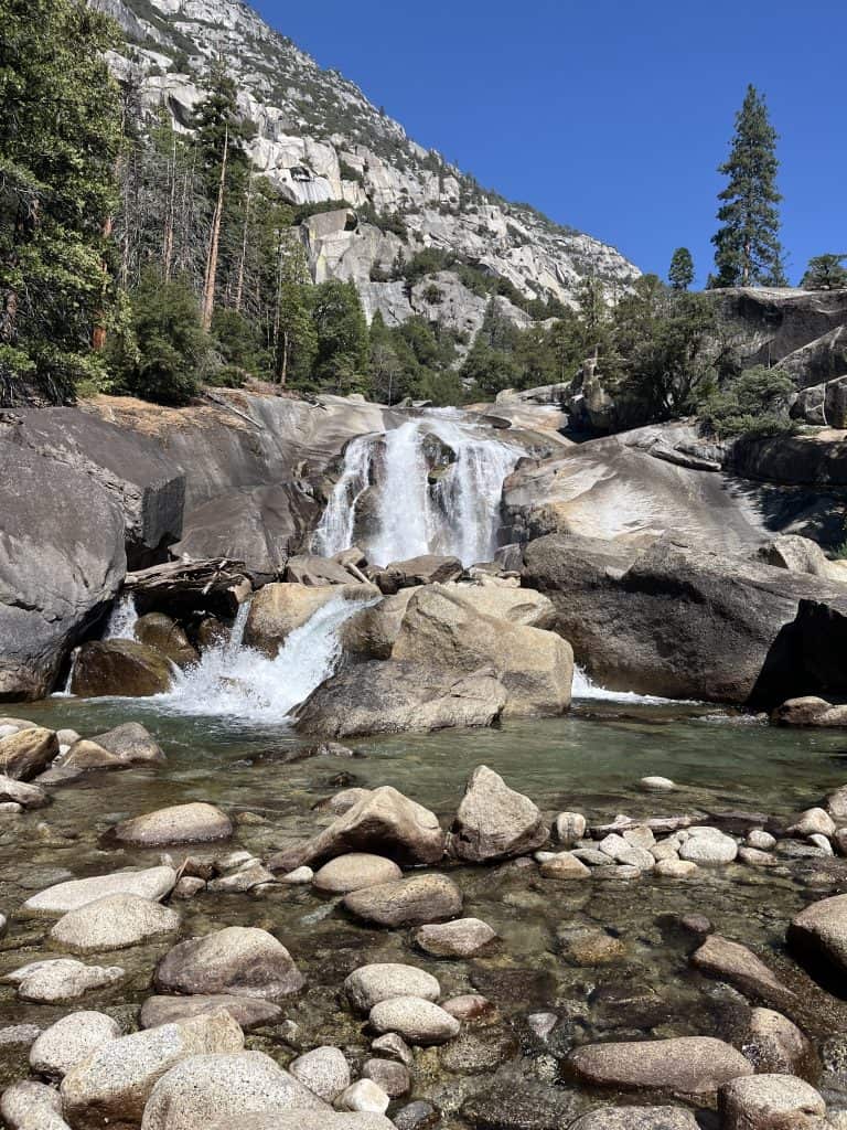 Mist Falls waterfall cascading over granite rocks along the Mist Falls Trail in Kings Canyon National Park, California.