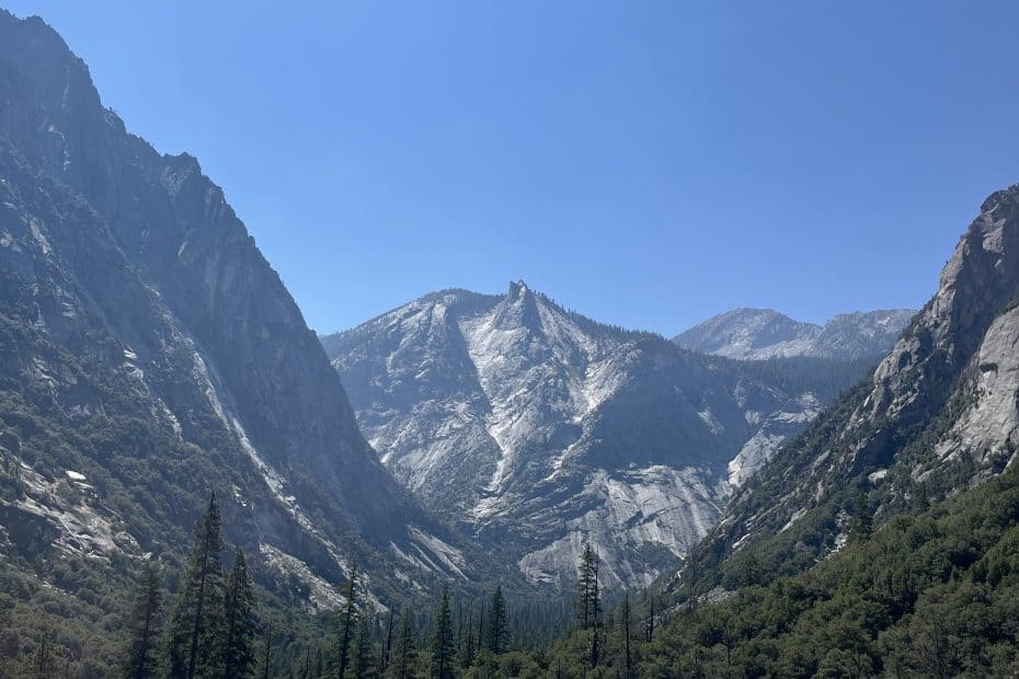 Granite canyon walls and forested valley along the Mist Falls Trail in Kings Canyon National Park, California.